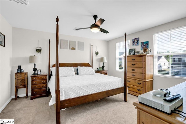 275 Ralston Rd, Greer, SC 29651 - bedroom featuring light colored carpet, multiple windows, ceiling fan, and baseboards