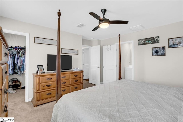 275 Ralston Rd, Greer, SC 29651 - bedroom featuring a walk in closet, light carpet, a closet, and a ceiling fan