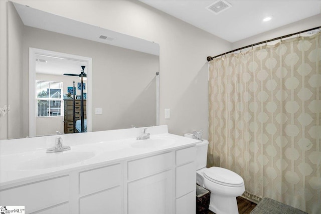 275 Ralston Rd, Greer, SC 29651 - full bathroom with toilet, double vanity, a shower with shower curtain, recessed lighting, and wood finished floors