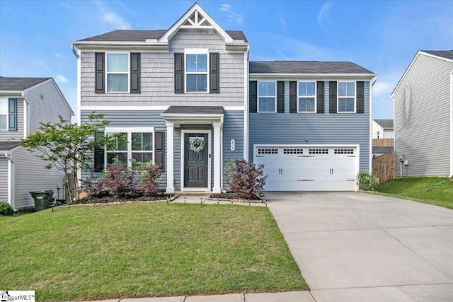 275 Ralston Rd, Greer, SC 29651 - view of front facade featuring concrete driveway, an attached garage, and a front lawn