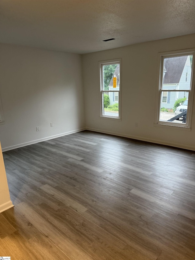 122 Franklin Dr, Central, SC 29630 - unfurnished room with dark wood-style flooring, baseboards, and a textured ceiling