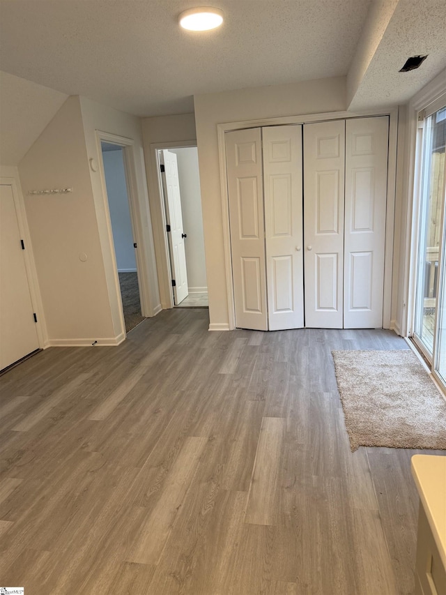 122 Franklin Dr, Central, SC 29630 - unfurnished bedroom with baseboards, wood finished floors, a closet, and a textured ceiling