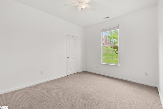 124 Bascom Ct, Greer, SC 29650 - spare room featuring light carpet, ceiling fan, and baseboards