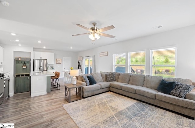 1019 Appalachian Dr, Moore, SC 29369 - living room with light wood-style flooring, a ceiling fan, and recessed lighting