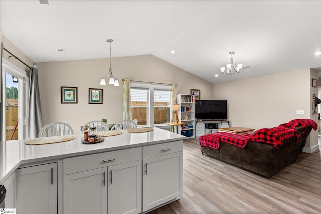 101 Sunrise Rd, Spartanburg, SC 29302 - kitchen with a chandelier, lofted ceiling, light wood-type flooring, hanging light fixtures, and open floor plan