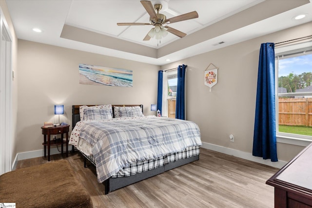 101 Sunrise Rd, Spartanburg, SC 29302 - bedroom featuring baseboards, a tray ceiling, light wood finished floors, recessed lighting, and ceiling fan