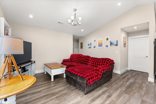 101 Sunrise Rd, Spartanburg, SC 29302 - living area with lofted ceiling, wood finished floors, a chandelier, baseboards, and recessed lighting