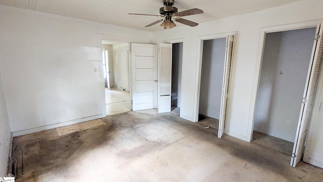 104 Albert St, Greer, SC 29651 - unfurnished bedroom with multiple closets, unfinished concrete floors, and ceiling fan