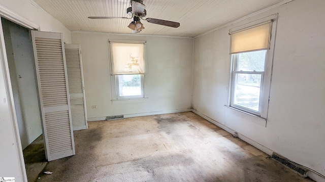 104 Albert St, Greer, SC 29651 - unfurnished bedroom with multiple windows, a closet, wood ceiling, unfinished concrete flooring, and a ceiling fan