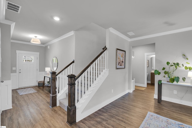 113 Marshfield Trl, Simpsonville, SC 29680 - entrance foyer featuring crown molding, wood finished floors, stairway, and baseboards