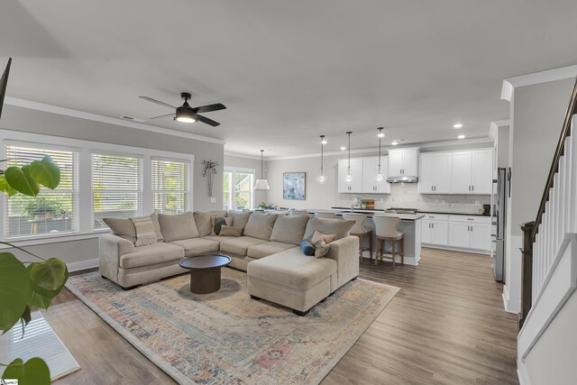 113 Marshfield Trl, Simpsonville, SC 29680 - living room with ornamental molding, stairway, ceiling fan, recessed lighting, and light wood-type flooring