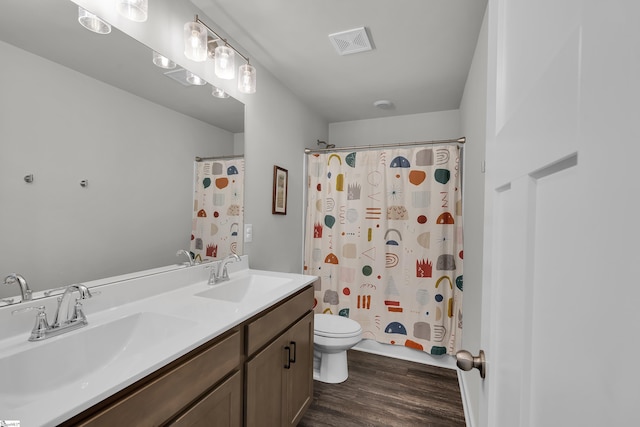 113 Marshfield Trl, Simpsonville, SC 29680 - full bathroom with double vanity, wood finished floors, toilet, and a shower with curtain