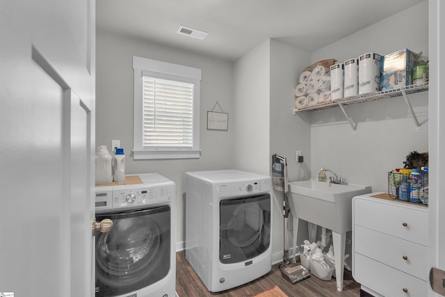 113 Marshfield Trl, Simpsonville, SC 29680 - laundry area featuring washing machine and dryer and dark wood-type flooring