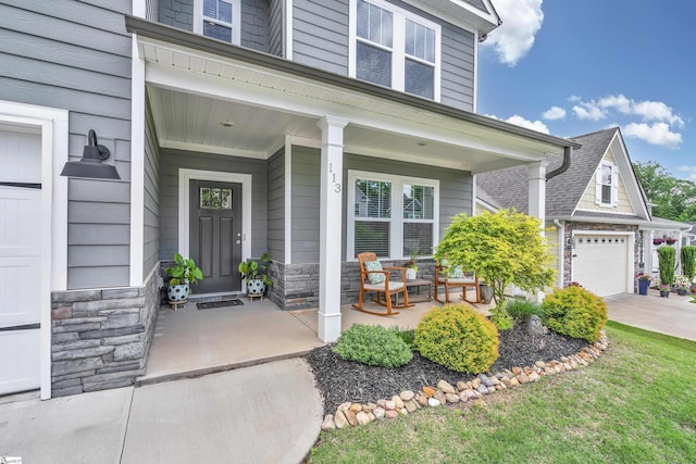 113 Marshfield Trl, Simpsonville, SC 29680 - view of exterior entry with a porch, stone siding, and driveway