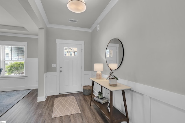 113 Marshfield Trl, Simpsonville, SC 29680 - foyer featuring a wainscoted wall, healthy amount of natural light, dark wood-style flooring, ornamental molding, and a decorative wall