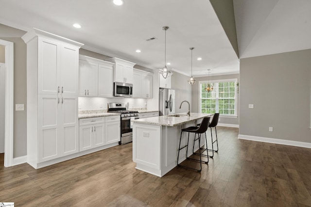 116 Woodstone Dr, Easley, SC 29642 - kitchen featuring appliances with stainless steel finishes, an island with sink, white cabinets, baseboards, and recessed lighting
