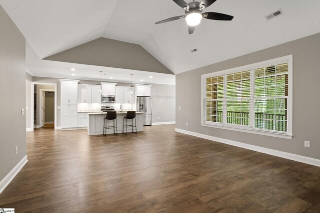 116 Woodstone Dr, Easley, SC 29642 - living area with a ceiling fan, vaulted ceiling, dark wood-style floors, baseboards, and recessed lighting