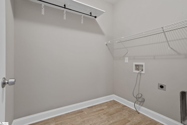 116 Woodstone Dr, Easley, SC 29642 - laundry area featuring electric dryer hookup, washer hookup, light wood-type flooring, and baseboards