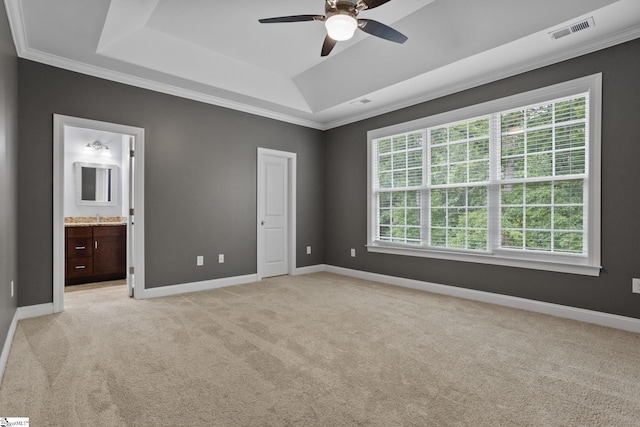 116 Woodstone Dr, Easley, SC 29642 - unfurnished bedroom featuring a tray ceiling, light colored carpet, multiple windows, baseboards, and crown molding