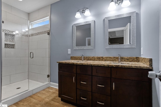 116 Woodstone Dr, Easley, SC 29642 - full bathroom with wood finished floors, double vanity, a shower stall, and baseboards