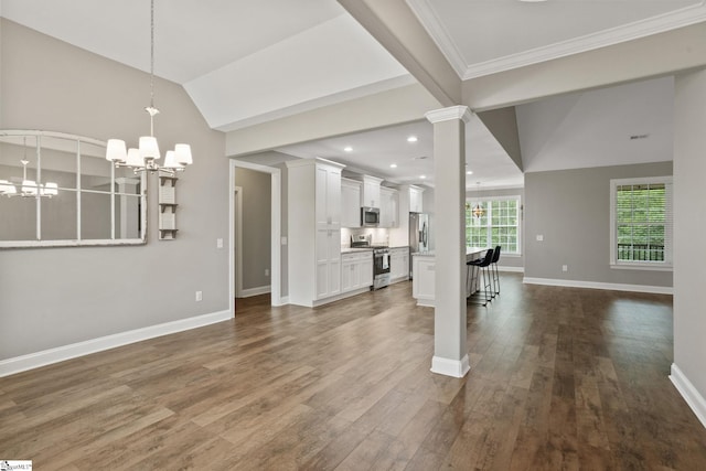 116 Woodstone Dr, Easley, SC 29642 - unfurnished living room featuring a chandelier, baseboards, dark wood-type flooring, ornamental molding, and recessed lighting