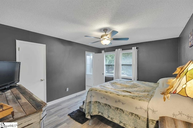 469 Royal Oak Dr, Spartanburg, SC 29302 - bedroom featuring wood finished floors, a textured ceiling, baseboards, and a ceiling fan