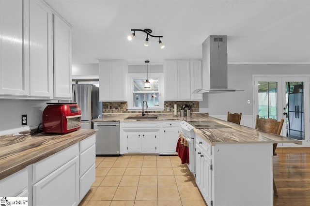 469 Royal Oak Dr, Spartanburg, SC 29302 - kitchen featuring appliances with stainless steel finishes, extractor fan, a sink, a peninsula, and french doors