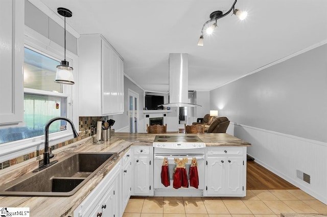 469 Royal Oak Dr, Spartanburg, SC 29302 - kitchen with a sink, light tile patterned flooring, crown molding, white cabinetry, and open floor plan