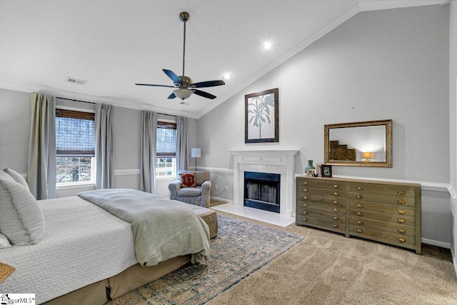 500 E Mountain Creek Rd, Taylors, SC 29687 - bedroom featuring ornamental molding, vaulted ceiling, a tile fireplace, carpet floors, and ceiling fan