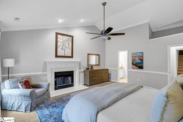 500 E Mountain Creek Rd, Taylors, SC 29687 - bedroom with ornamental molding, lofted ceiling, ensuite bathroom, a tiled fireplace, and ceiling fan