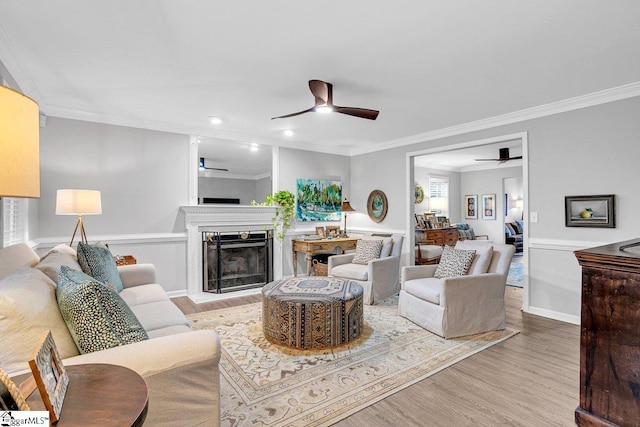 500 E Mountain Creek Rd, Taylors, SC 29687 - living room with ceiling fan, ornamental molding, wood finished floors, a fireplace with raised hearth, and recessed lighting