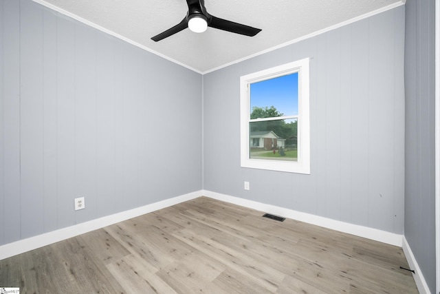 127 Chelsea St, Moore, SC 29369 - empty room featuring crown molding, wood finished floors, a ceiling fan, baseboards, and a textured ceiling