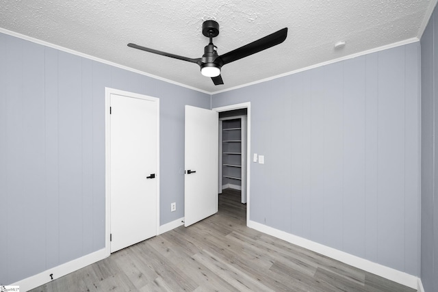 127 Chelsea St, Moore, SC 29369 - unfurnished bedroom featuring wood finished floors, a textured ceiling, ornamental molding, baseboards, and ceiling fan