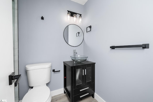 127 Chelsea St, Moore, SC 29369 - bathroom featuring toilet, baseboards, vanity, and wood finished floors