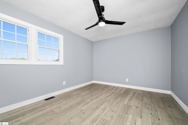 127 Chelsea St, Moore, SC 29369 - empty room with wood finished floors, baseboards, a textured ceiling, and ceiling fan