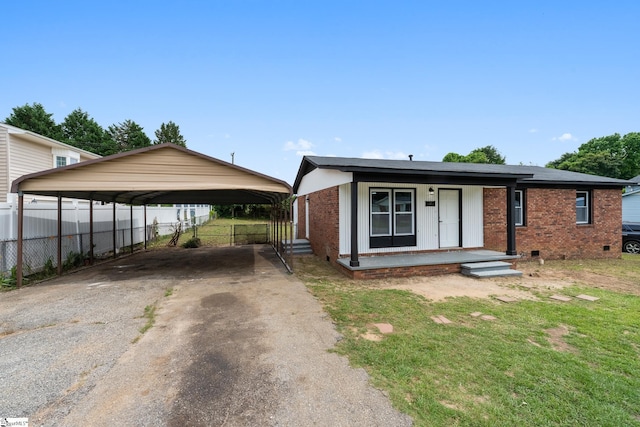 127 Chelsea St, Moore, SC 29369 - view of front of house with asphalt driveway, brick siding, a detached carport, and crawl space