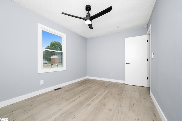 127 Chelsea St, Moore, SC 29369 - empty room featuring light wood-style flooring, a ceiling fan, baseboards, and a textured ceiling