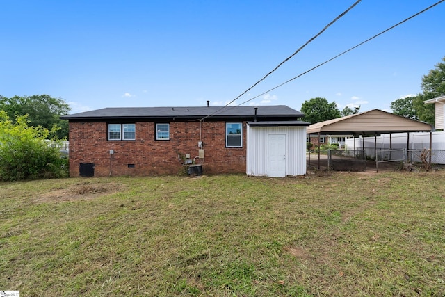 127 Chelsea St, Moore, SC 29369 - rear view of property featuring a detached carport, crawl space, brick siding, and central AC