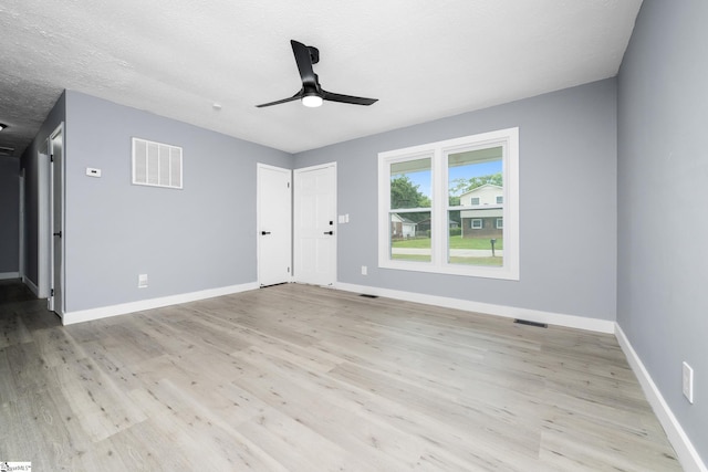 127 Chelsea St, Moore, SC 29369 - spare room featuring light wood-type flooring, baseboards, ceiling fan, and a textured ceiling
