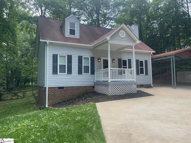 1002 Still Holllow Ln, Taylors, SC 29687 - view of front of house with crawl space, concrete driveway, a carport, covered porch, and a front yard