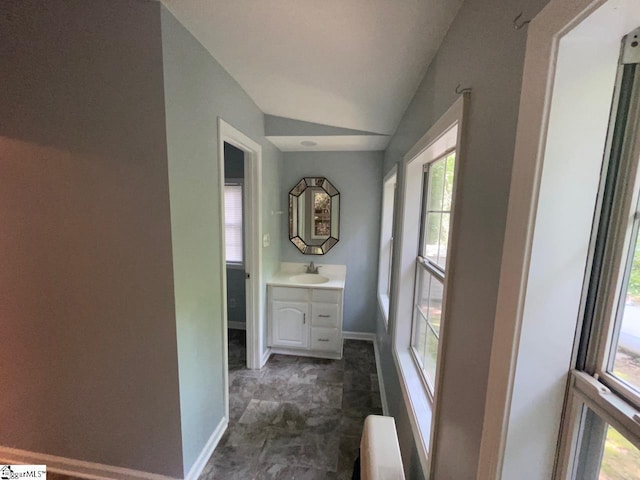 1002 Still Holllow Ln, Taylors, SC 29687 - bathroom with vanity, baseboards, radiator, and vaulted ceiling