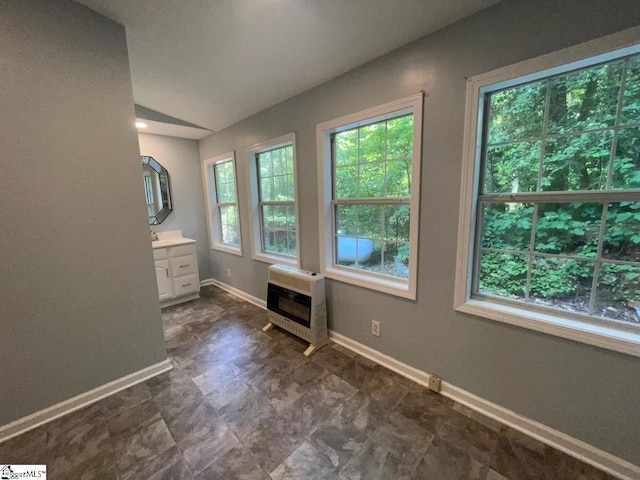1002 Still Holllow Ln, Taylors, SC 29687 - bathroom with heating unit, vanity, baseboards, and lofted ceiling