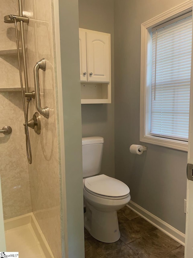 1002 Still Holllow Ln, Taylors, SC 29687 - full bath featuring a stall shower, toilet, and baseboards