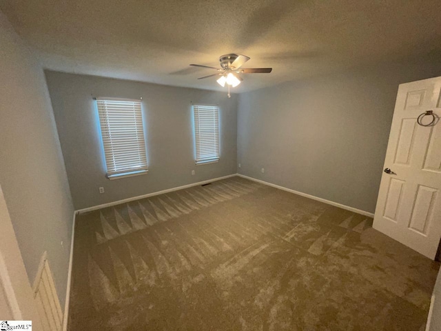 1002 Still Holllow Ln, Taylors, SC 29687 - spare room featuring a ceiling fan, carpet floors, baseboards, and a textured ceiling