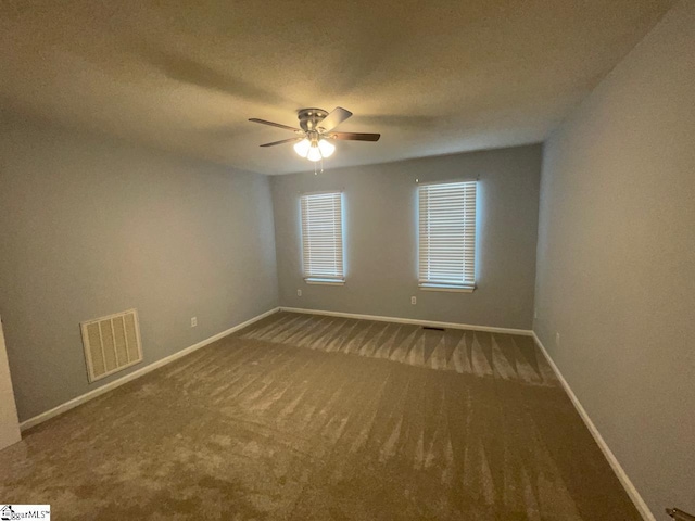 1002 Still Holllow Ln, Taylors, SC 29687 - spare room with a ceiling fan, carpet, baseboards, and a textured ceiling
