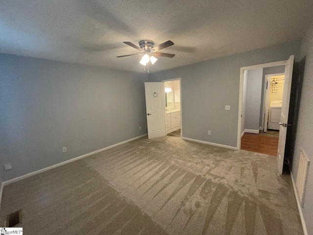 1002 Still Holllow Ln, Taylors, SC 29687 - unfurnished bedroom featuring carpet floors, baseboards, washer / clothes dryer, ensuite bath, and a ceiling fan