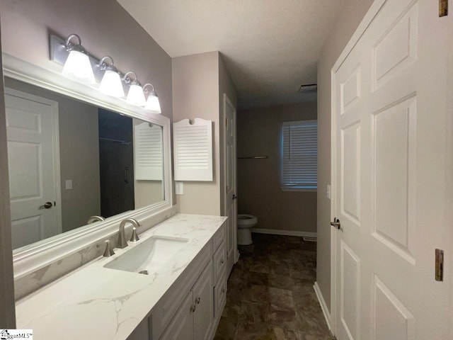 1002 Still Holllow Ln, Taylors, SC 29687 - bathroom featuring vanity, toilet, and baseboards