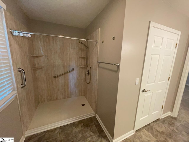 1002 Still Holllow Ln, Taylors, SC 29687 - bathroom featuring a shower and baseboards