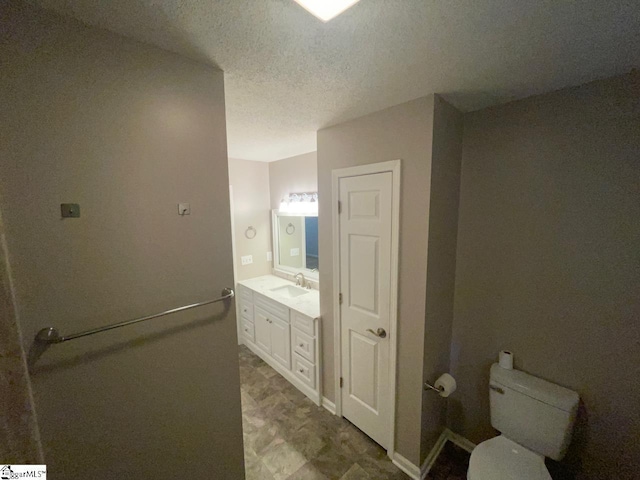1002 Still Holllow Ln, Taylors, SC 29687 - bathroom with vanity, toilet, and a textured ceiling