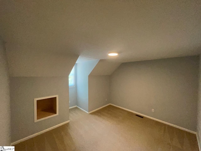 1002 Still Holllow Ln, Taylors, SC 29687 - additional living space featuring carpet floors, vaulted ceiling, and baseboards